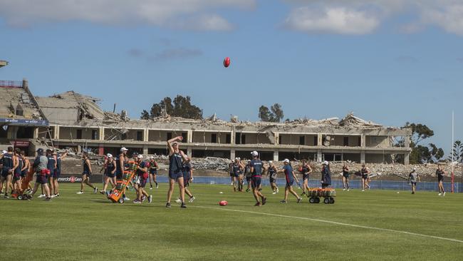 Adelaide Crows training at Football Park during the demolition of the grandstands. Picture: Simon Cross