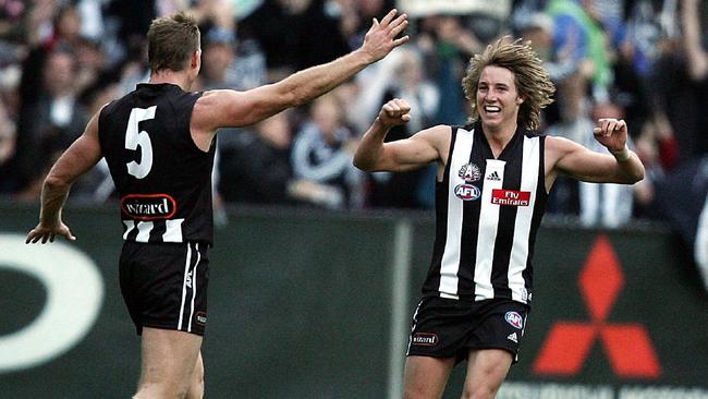 Nathan Buckley and Dale Thomas celebrate a goal in 2006.