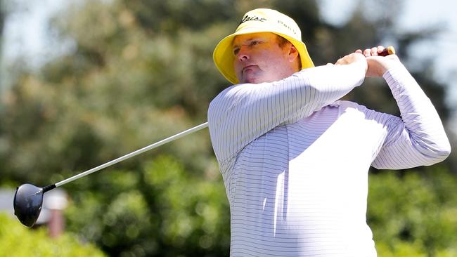 Jarrod Lyle tees off in his trademark yellow bucket hat. Picture: