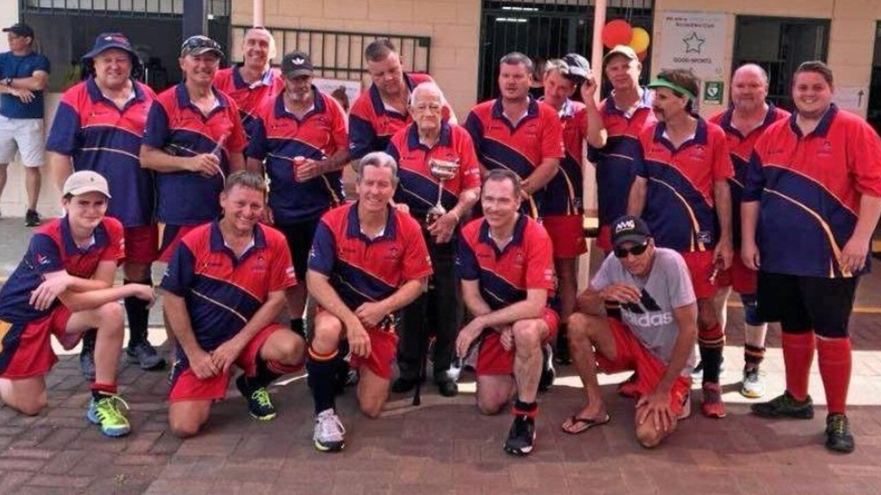 Col Hamilton holds the premiership trophy after Team Hamilton won the Rockhampton Hockey Association A3 men's title in 2018.