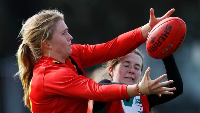 Sara Kennedy (left) of Ballarat Clarendon College competes with the football with Ida Laherty of Clonard College. Kennedy is one of the best young cricketers in the state. Photo by Dylan Burns/AFL Photos via Getty Images