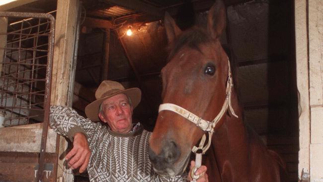 Former Melbourne Cup winner Just A Dash with Flemington clerk of course John Patterson at his Flemington stables in 1997. Picture: Herald Sun File