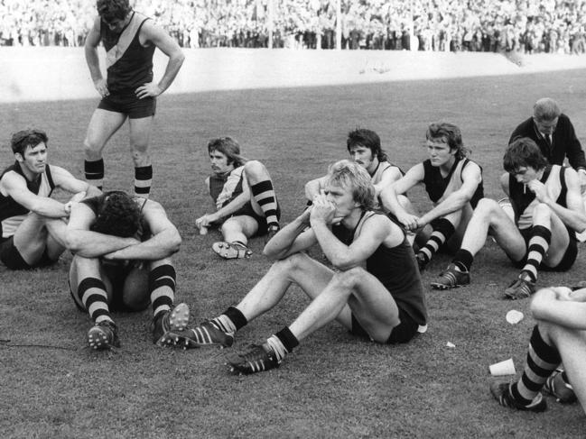 SANFL football - Despondent Glenelg footballers after losing grand final to Norwood at Football Park 27 Sep 1975. LIB FILE: G FOOTBALL: SA - Matches - Finals 1975