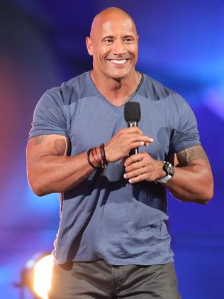 And him now — with $200 million to his name. Still owning that “Rock” smile. Photo by Christopher Polk/Getty Images for Spike.