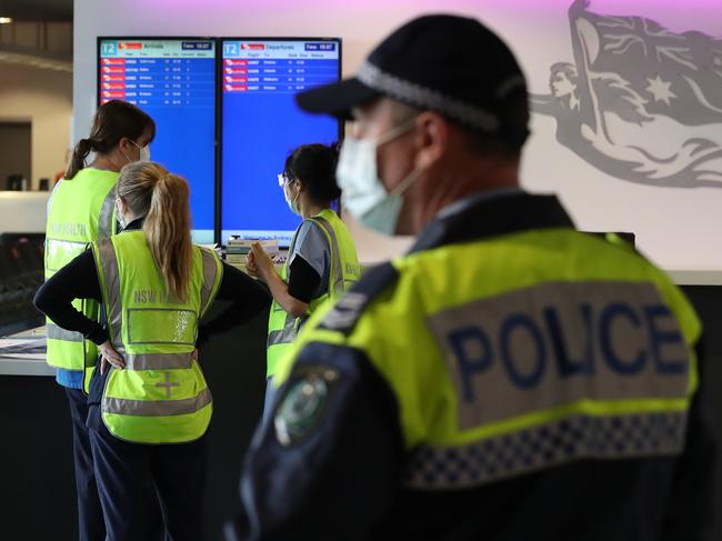 SYDNEY, AUSTRALIA NewsWire Photos JUNE 7: NSW Health workers and NSW Police were inside the T2 terminal at Sydney Airport this afternoon to perform Covid testing on passengers arriving on a flight from Melbourne. Picture: NCA NewsWire/David Swift