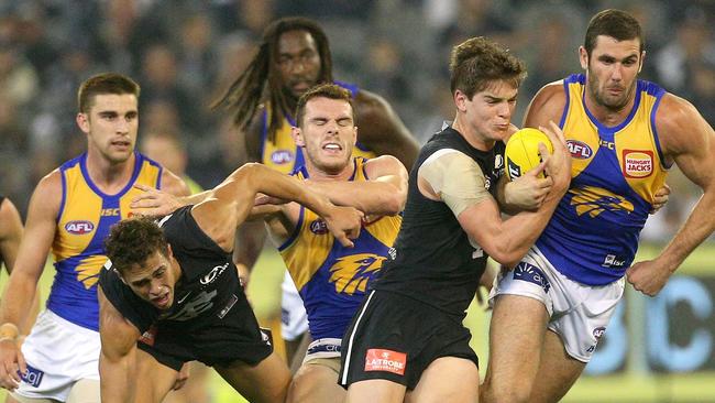 Paddy Dow tries to rip the ball from Jack Darling. Picture: AAP