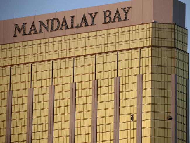 Drapes billow out of broken windows at the Mandalay Bay resort and casino on the Las Vegas Strip. Picture: AP