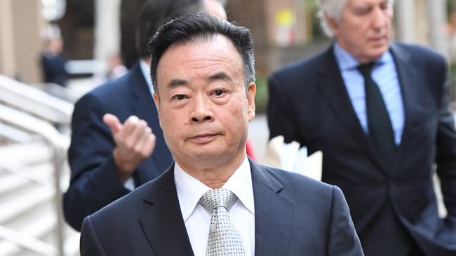 Businessman Chau Chak Wing leaves the NSW Federal Court.