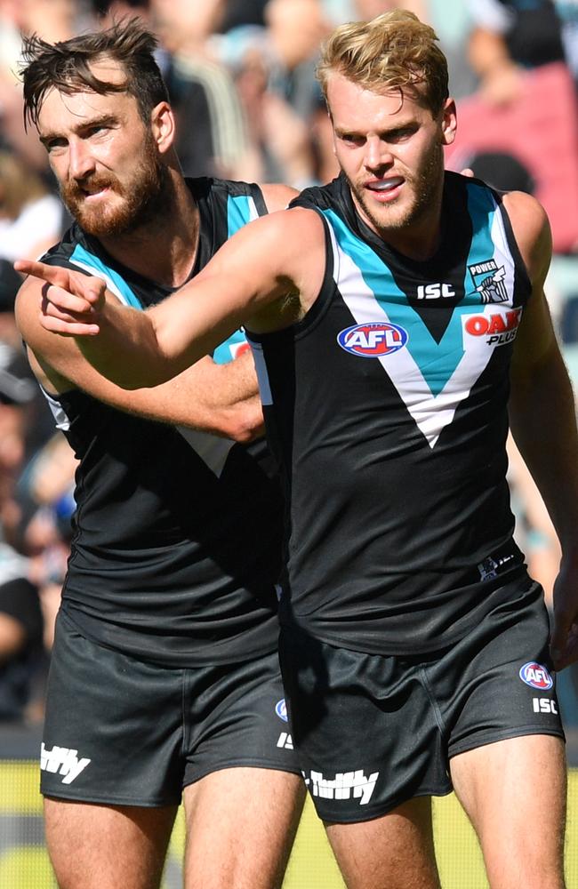 Jack Watts, right, and Charlie Dixon celebrate a goal against Brisbane. Picture: AAP