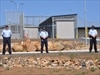 Police officers outside a detention centre