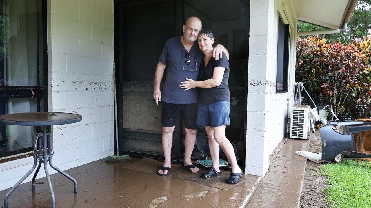 Ted Fay and Pam Fay console each other as they walk into their Clitheroe Street home. Picture: Brendan Radke