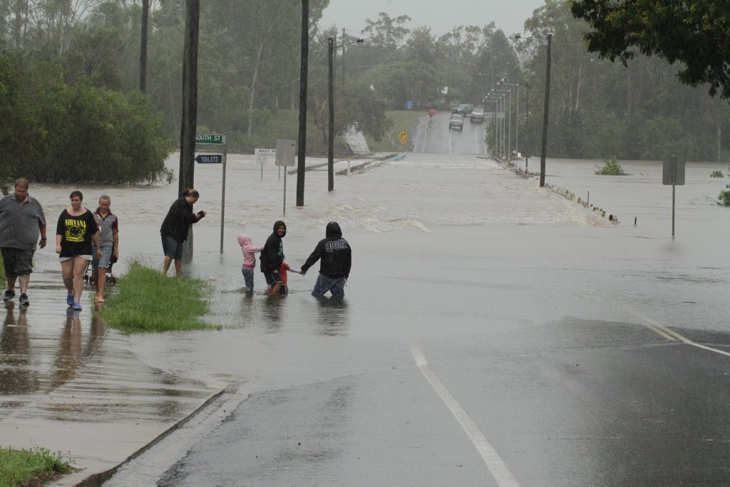 Sightseers watch the Mary River rise at the Lammington Bridge. Photo: Robyne Cuerel / Fraser Coast Chronicle. Picture: Robyne Cuerel