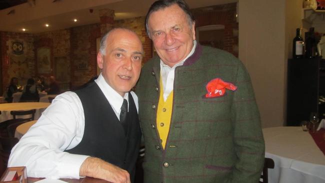 Barry Humphries with staff member Damiano at Enzo's restaurant.