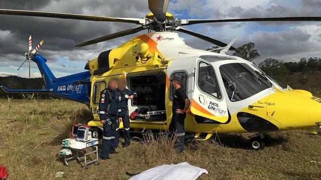 Paramedics attend the man at the Gympie region property before he was airlifted to hospital.