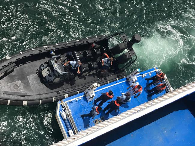 Police prepare to board the P&amp;O cruise ship at Bradleys Head. Picture: Leanne Lane