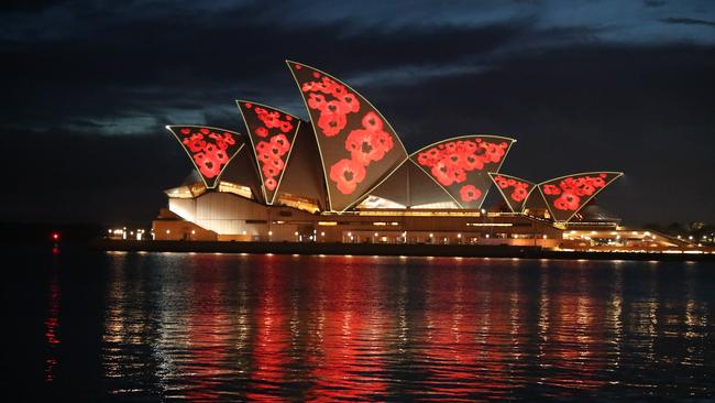 The sails of the Opera House were illuminated with poppies to mark Remembrance Day. Picture John Grainger