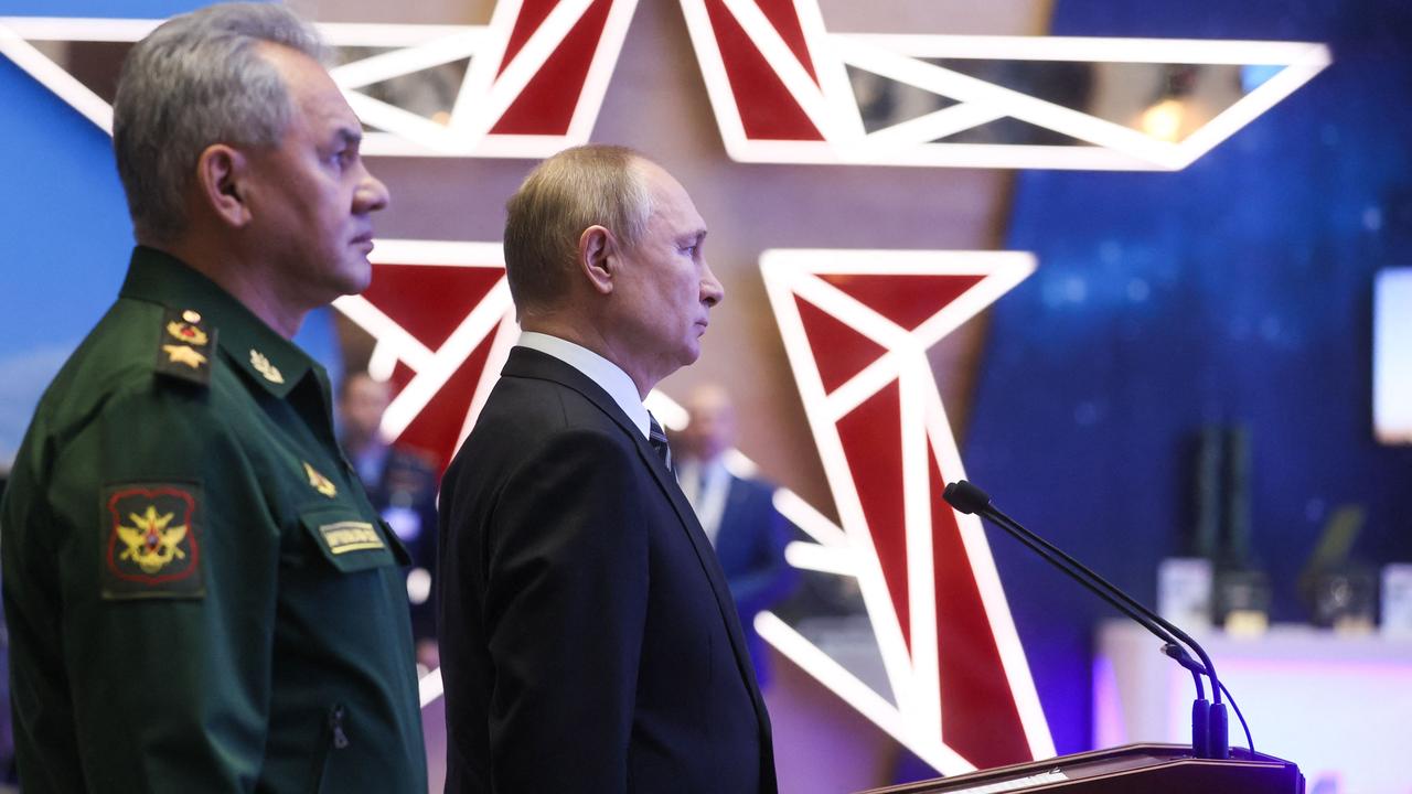 Russian President Vladimir Putin and Defence Minister Sergei Shoigu tour a military gear exhibition before the annual meeting of the Defence Ministry board in Moscow on December 21, 2021. Picture: Mikhail Metzel/Sputnik/AFP