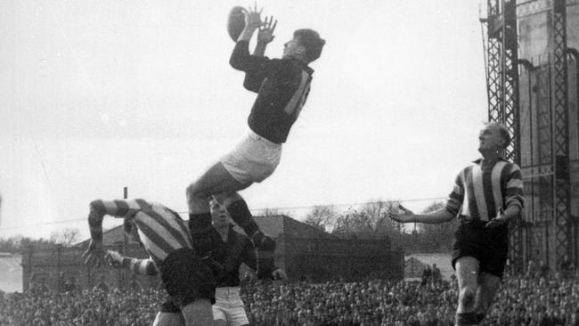 John Coleman takes one of his trademark grabs against North Melbourne at Arden St.