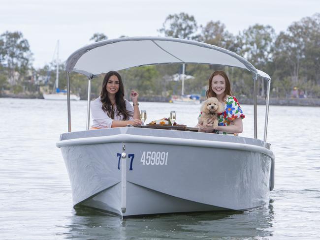 Tara Carroll and Tess Alexander aboard a GoBoat on the Brisbane River. Picture: Jerad Williams