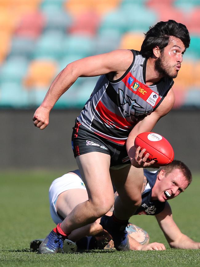 Lauderdale’s Phillip Bellchambers looks to handball in last year’s TSL preliminary final. Picture: NIKKI DAVIS-JONES