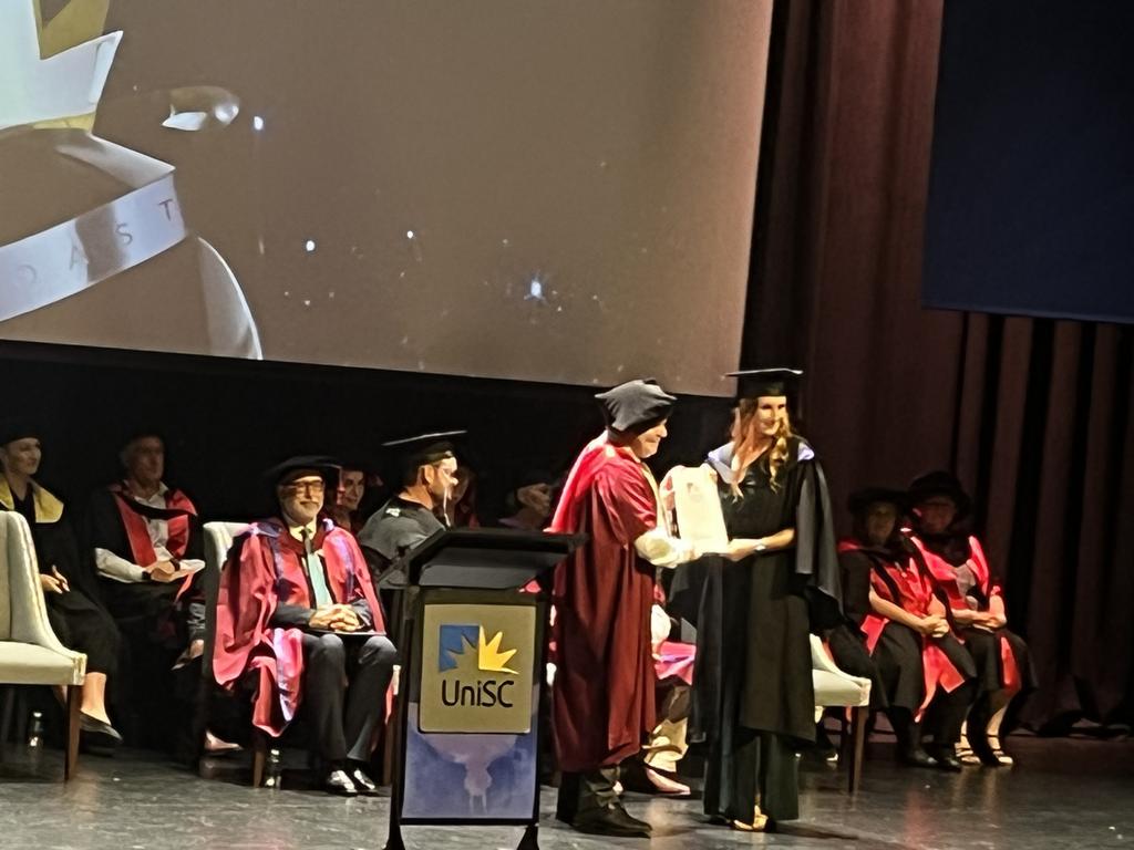 Graduates from the University of the Sunshine Coast's Fraser Coast campus celebrating at the Brolga Theatre.