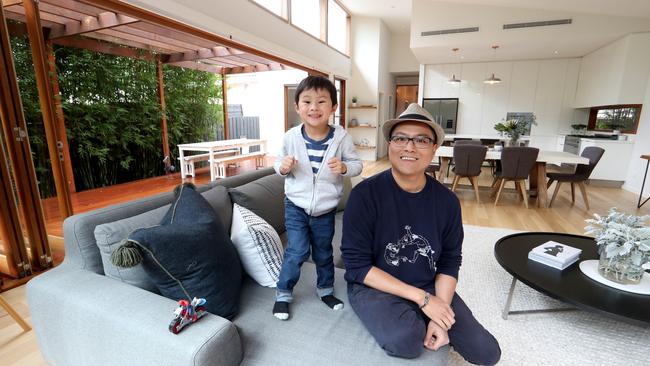 Jck Reyes with his son Jacob, 3, at their house in Brunswick, Melbourne, which goes to auction on March 21. Picture: David Geraghty