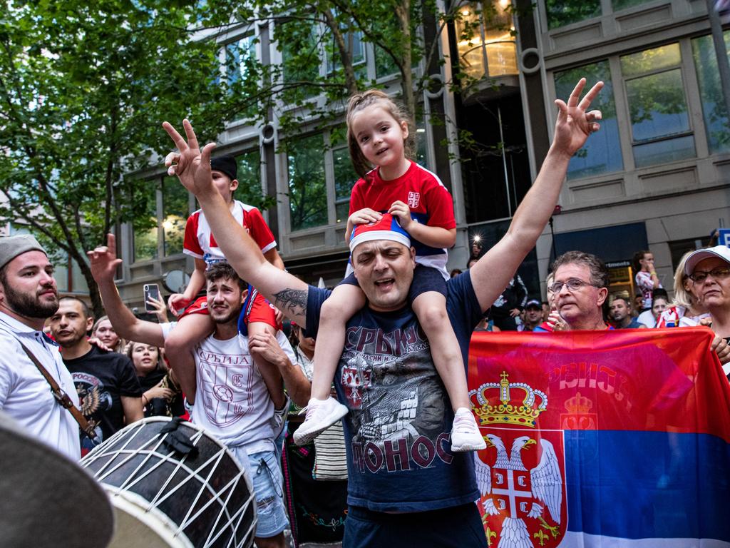 Serbian tennis fans celebrate after Djokovic’s court win. Picture: Diego Fedele/Getty Images