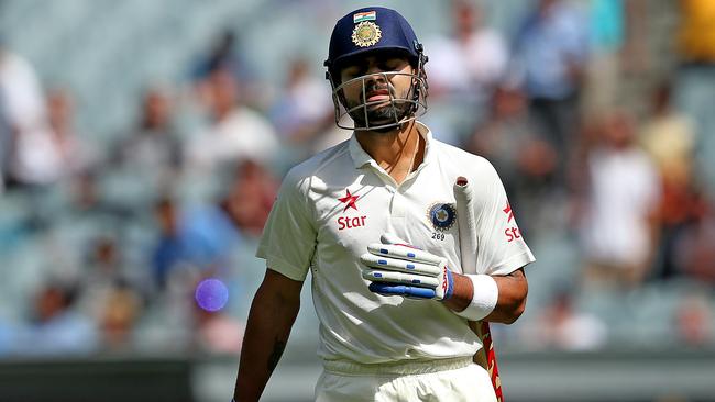 Kohli feels the pain after losing his wicket against Australia in 2014. Picture: Colleen Petch