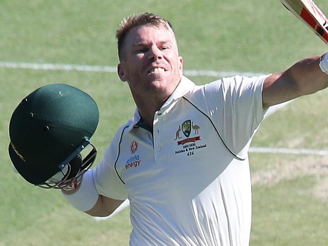 BRISBANE, AUSTRALIA - NOVEMBER 22: David Warner of Australia celebrates bringing up one hundred runs during day two of the 1st Domain Test between Australia and Pakistan at The Gabba on November 22, 2019 in Brisbane, Australia. (Photo by Jono Searle - CA/Cricket Australia via Getty Images)