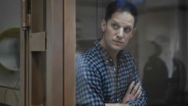 US journalist Evan Gershkovich, arrested on espionage charges, stands inside a defendants' cage before a hearing to consider an appeal on his arrest in Moscow. Picture: AFP.