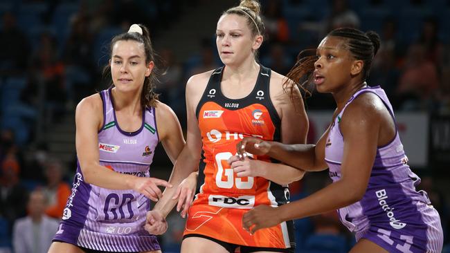 Ruby Bakewell-Doran (left) and Eboni Usoro-Brown defend Giants shooter Jo Harten (centre). Photo: Getty Images