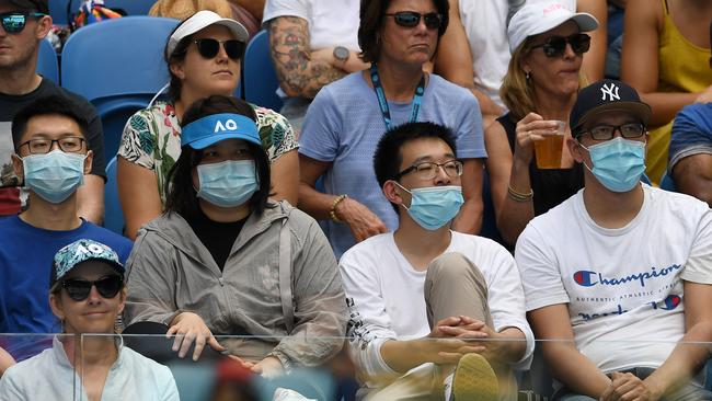 Spectators wearing facemasks at the Australian Open this week. Picture: AFP