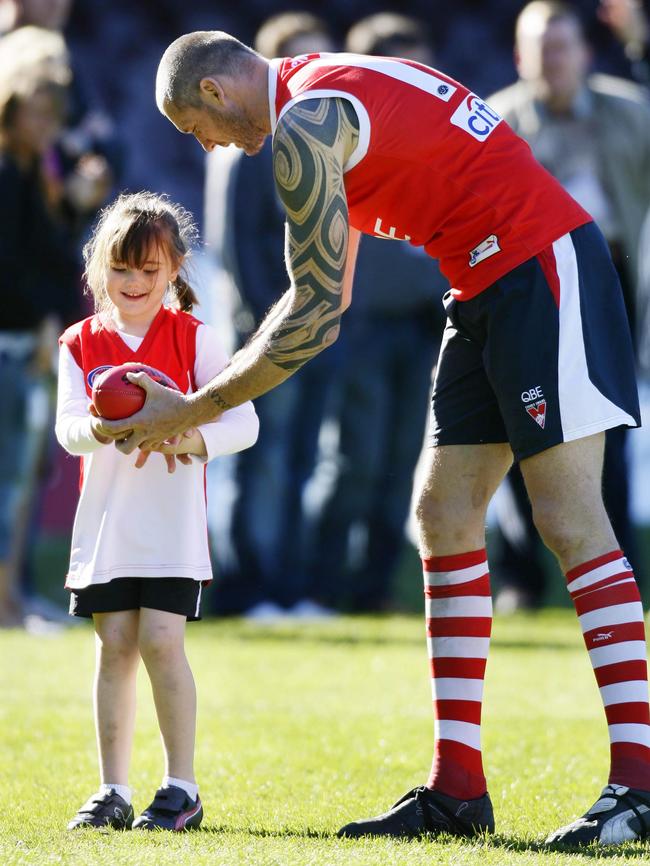 Spida Everitt shows daughter Annais how to pass.