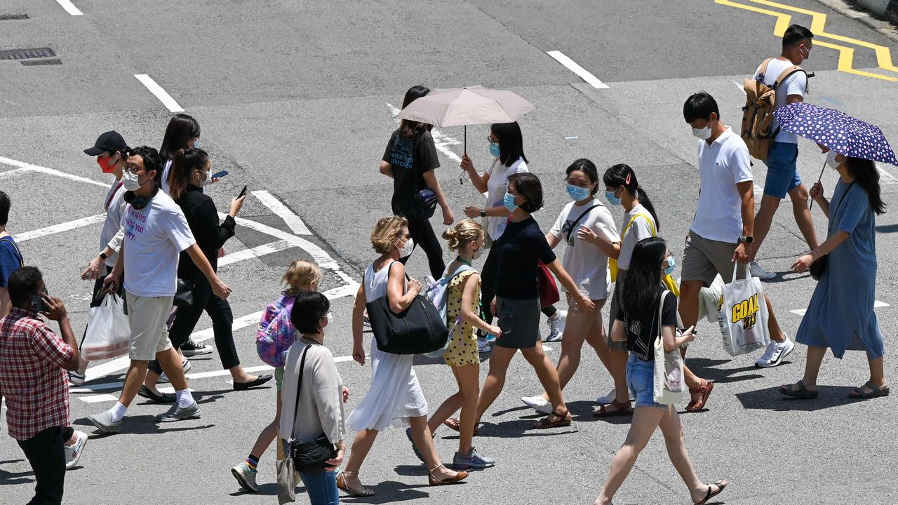 ‘If Singapore is never willing to let cases rise, it will be stuck fighting the pandemic for years.’ Picture: Roslan Rahman/AFP