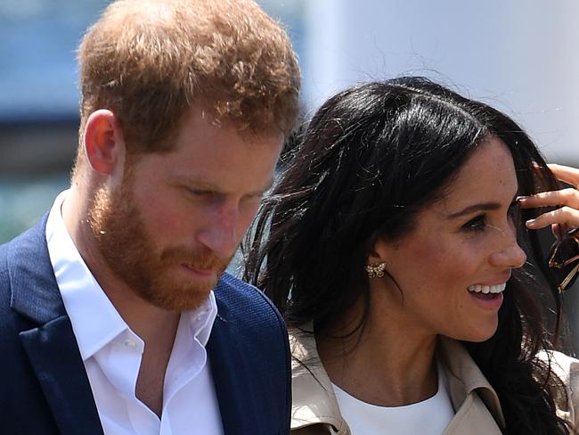 Britain's Prince Harry, the Duke of Sussex, and his wife Meghan, the Duchess of Sussex, are seen arriving at the Sydney Opera House in Sydney, Australia, Tuesday, October 16, 2018. The Duke and Duchess of Sussex are on a 3-week tour of Australia, New Zealand, Tonga, and Fiji and are in Sydney to launch the 2018 Invictus Games, an Olympic-style event for disabled and ill service people. (AAP Image/Dan Himbrechts) NO ARCHIVING