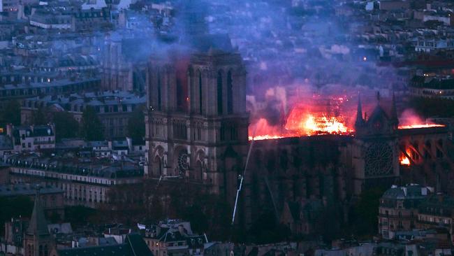 Flames and smoke billow from the roof at Notre-Dame Cathedral. Picture: AFP.