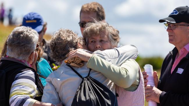 Pat Jenkins hugs a family member. Walk for Lyn Dawson at Long Reef Surf Club in Sydney NSW. Lyn went missing in 1982, and her body has never been found. Sunday 30th September 2018. (AAP Image/Jordan Shields)