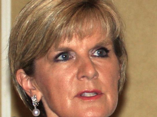 Indonesian Foreign Minister Marty Natalegawa, right, listens to his Australian counterpart Julie Bishop during a press conference in Bali, Indonesia, Thursday, Aug. 28, 2014. Australia and Indonesia have reached a new agreement on how they'll use their intelligence operations in the future, even settling their disagreement on its name.(AP Photo/Firdia Lisnawati)