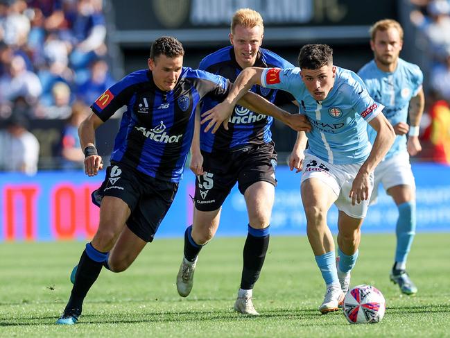 Louis Verstraete of Auckland challenges Medin Memeti. Picture: Getty Images