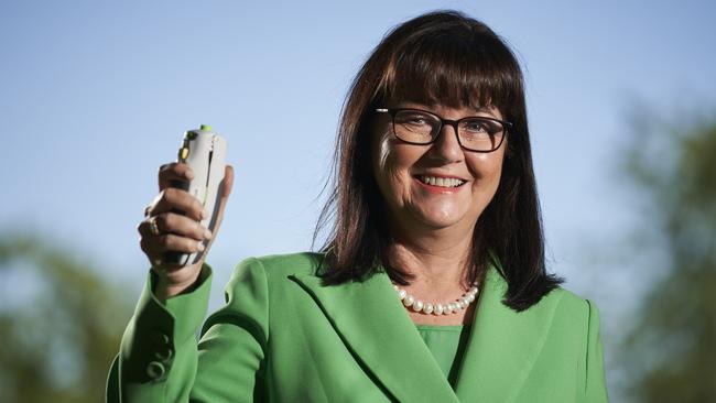 Professor Helen Marshall with the needle-free jet spray vaccination device. Picture: Matt Loxton