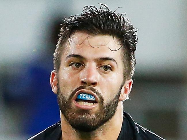 GOLD COAST, AUSTRALIA - MARCH 19: James Tedesco of the tigers runs with ball during the round three NRL match between the Gold Coast Titans and the Wests Tigers at Cbus Super Stadium on March 19, 2016 in Gold Coast, Australia. (Photo by Jason O'Brien/Getty Images)