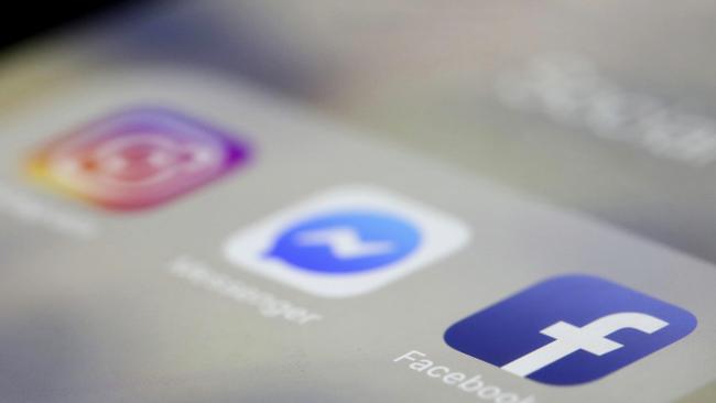 Facebook, Messenger and Instagram apps are are displayed on an iPhone on Wednesday, March 13, 2019, in New York. Facebook says it is aware of outages on its platforms including Facebook, Messenger and Instagram and is working to resolve the issue. (AP Photo/Jenny Kane)