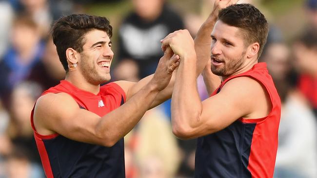 Jesse Hogan of the Demons is congratulated by Christian Petracca.