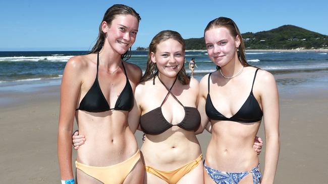 South Coast Schoolies Milly Guilfoyle, Lara Tait and Maddie Scott relax in Byron Bay. Photograph: Jason O'Brien
