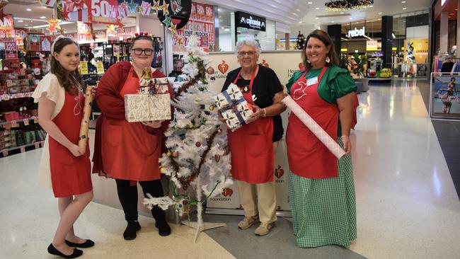 Heart Foundation Christmas wrapping station volunteers Mikayla Stevens, Madeline Roberts, Karen Baker and Angelina Spidy-Brown at Stockland Rockhampton.