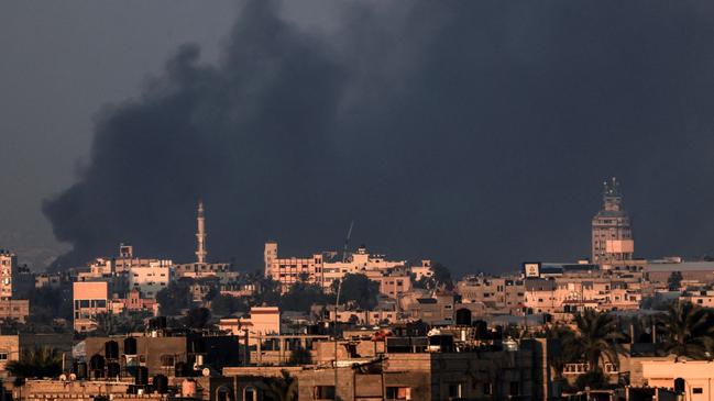 Smoke on Friday covers the skyline of Khan Younis in the southern Gaza Strip where Israeli forces have expanded their military operations. Picture: AFP/Getty Images