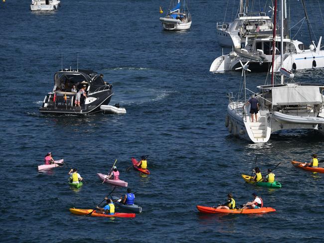 People on Canoes and Yachts gather at Farm Cove in preparation for New Years Eve Fireworks in Sydney, Monday, December 31, 2018. Picture: AAP / Brendan Esposito
