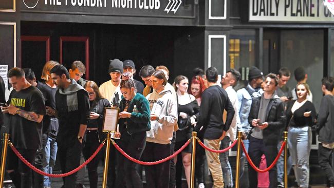 People queue outside Prohibition nightclub in Fortitude Valley despite the State Government’s social distancing guidelines. Picture: John Gass