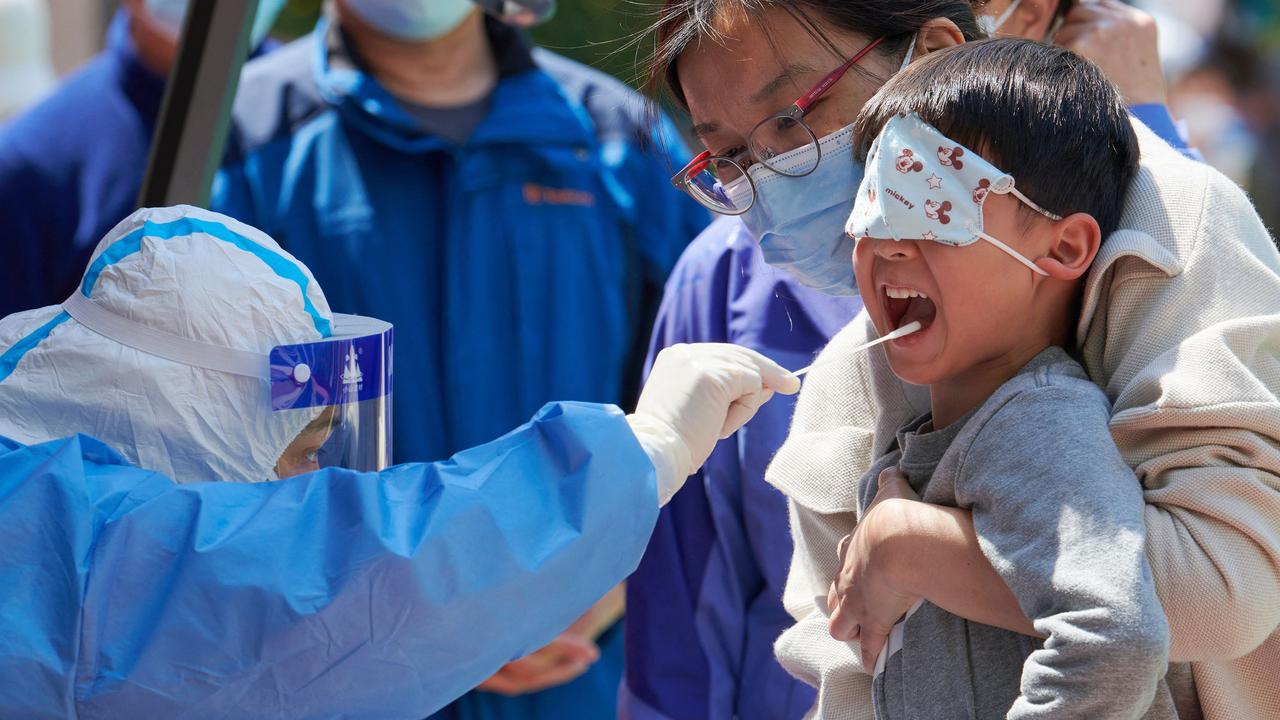 A child is tested for Covid-19 during a lockdown in Shanghai. Picture: Liu Jin/AFP