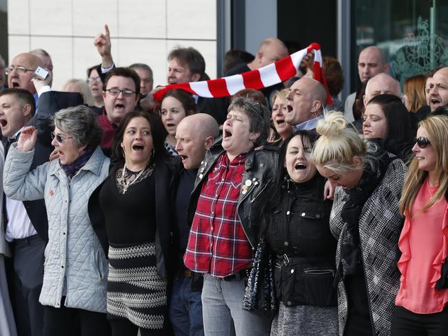 Relatives of those who died in the Hillsborough disaster sing ‘You'll Never Walk Alone’ outside the Hillsborough Inquest. Picture: Joe Giddens/PA via AP